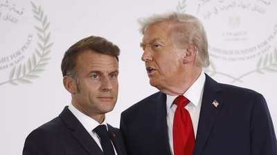 US President Donald Trump talks to French President Emmanuel Macron. (AP File) US President Donald Trump talks to French President Emmanuel Macron. (AP File)