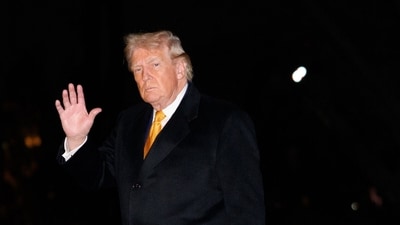 US President Donald Trump walks on the South Lawn of the White House after arriving on Marine One in Washington (Bloomberg) US President Donald Trump walks on the South Lawn of the White House after arriving on Marine One in Washington (Bloomberg)