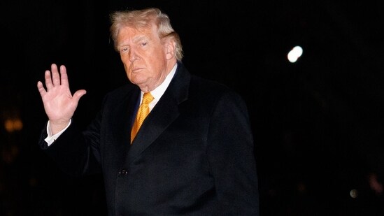 US President Donald Trump walks on the South Lawn of the White House after arriving on Marine One in Washington (Bloomberg)