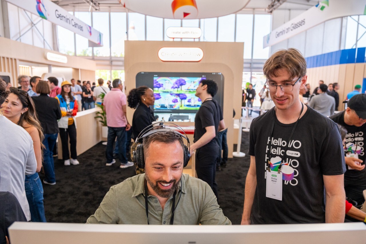 Conference attendees trying out activities that highlight Google's Gemini AI. Conference attendees trying out activities that highlight Google's Gemini AI.