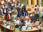 BJP legislators storm the Well of the House on Wednesday. (Arvind Yadav/HT)