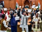 Bharatiya Janata Party (BJP) MLAs and ministers stage a protest against Delhi Assembly Leader of Opposition Atishi over her alleged remarks on a Sikh Guru during the winter session of the Delhi Legislative Assembly at the Vidhan Sabha, in New Delhi on Thursday. (Delhi Government)