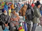 Passengers waiting for buses in Ludhiana on Thursday. (Gurpreet Singh/HT) Passengers waiting for buses in Ludhiana on Thursday. (Gurpreet Singh/HT)