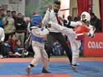 Players in action during a taekwondo match in School National Games being played at PAU Government School in Ludhiana on Wednesday (Gurpreet Singh/HT)