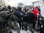 Protesters clash with federal agents outside the Bishop Henry Whipple Federal Building in Saint Paul, Minnesota, on January 8, 2026. 