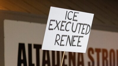 A person holds a sign following the death of Renee Nicole Good, a 37-year-old woman who was shot in her car by a U.S. immigration agent, according to local and federal officials, in Minneapolis, as Altadena community members gather at an event marking the first anniversary of the devastating Eaton Fire, in Altadena, California, U.S., January 7, 2026. REUTERS/Mike Blake (REUTERS)