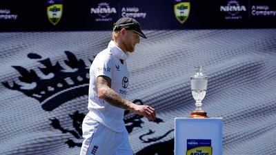 Ben Stokes walks past the trophy on the podium after the match. (REUTERS)