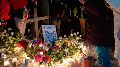 Community members pray during a vigil following a fatal shooting by an Immigration and Customs Enforcement (ICE) agent in Minneapolis, Minnesota, US, on Wednesday, Jan. 7, 2026. (Photographer: Jaida Grey Eagle/Bloomberg) (Bloomberg) Community members pray during a vigil following a fatal shooting by an Immigration and Customs Enforcement (ICE) agent in Minneapolis, Minnesota, US, on Wednesday, Jan. 7, 2026. (Photographer: Jaida Grey Eagle/Bloomberg) (Bloomberg)