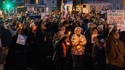 Community members hold a vigil after an ICE agent shot Renee Nicole Good dead in Minneapolis, Minnesota, US, on Wednesday, Jan. 7, 2026. This sparked an uproar over the presence of ICE agents in the city and heightening political divisions around the Trump administration's migrant crackdown. (Photographer: Jaida Grey Eagle/Bloomberg) (Bloomberg) Community members hold a vigil after an ICE agent shot Renee Nicole Good dead in Minneapolis, Minnesota, US, on Wednesday, Jan. 7, 2026. This sparked an uproar over the presence of ICE agents in the city and heightening political divisions around the Trump administration's migrant crackdown. (Photographer: Jaida Grey Eagle/Bloomberg) (Bloomberg)