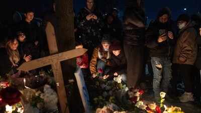 People gather to honor Renee Nicole Good at a memorial in Minneapolis on January 7, 2026. (Photo by SCOTT OLSON / GETTY IMAGES NORTH AMERICA / Getty Images via AFP) (Getty Images via AFP)