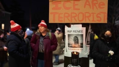 A sign reading ‘RIP Renee, murdered by ICE’ is displayed next to a memorial for Renee Nicole Good. (Photo by SCOTT OLSON / GETTY IMAGES NORTH AMERICA / Getty Images via AFP) (Getty Images via AFP)