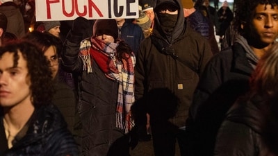 (EDITOR'S NOTE: Image contains profanity.) People participate in a protest against ICE after Renee Nicole died in a Minneapolis shooting.&nbsp;(Photo by SCOTT OLSON / GETTY IMAGES NORTH AMERICA / Getty Images via AFP) (Getty Images via AFP)