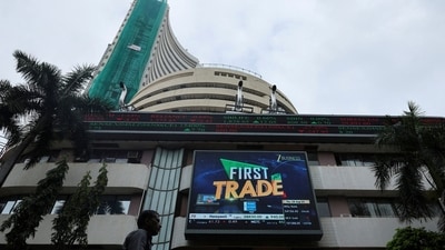 FILE PHOTO: A man walks near a screen outside the Bombay Stock Exchange (BSE) in Mumbai, India, August 28, 2025. REUTERS/Francis Mascarenhas/File Photo (REUTERS)