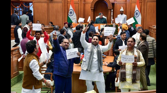 Bharatiya Janata Party (BJP) MLAs and ministers stage a protest against Delhi Assembly Leader of Opposition Atishi over her alleged remarks on a Sikh Guru during the winter session of the Delhi Legislative Assembly at the Vidhan Sabha, in New Delhi on Thursday. (Delhi Government)