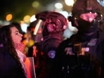 A protestor shouts at a Portland police officer outside the US Immigration and Customs Enforcement facility on Thursday, Jan. 8, 2026, in Portland, Ore. (AP Photo/Jenny Kane)
