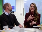 Britain's Prince William (L), Prince of Wales, looks on as Catherine (R), Princess of Wales, speaks with healthcare staff during a visit to Charing Cross Hospital in west London on January 8, 2026, to highlight the work of NHS staff and volunteers. (Photo by Isabel Infantes / POOL / AFP)(AFP)