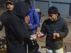Boxers waiting outside their accommodation during the National Championships in Greater Noida. (HT Photo)