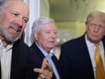 US Commerce Secretary Howard Lutnick (left) and Senator Lindsey Graham (centre) and President Donald Trump speak to reporters aboard Air Force One on 4 January 2026.