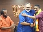 Kerala BJP chief Rajeev Chandrashekhar welcomes Lukose into party in Thiruvananthapuram on Thursday. (HT PHOTO)