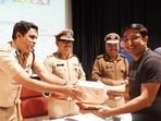 Pune commissioner of police Amitesh Kumar on Thursday felicitated five Pune residents for reporting highest number of traffic violations through the Pune Traffic Police (PTP) mobile application. (HT) Pune commissioner of police Amitesh Kumar on Thursday felicitated five Pune residents for reporting highest number of traffic violations through the Pune Traffic Police (PTP) mobile application. (HT)