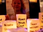 A photo of Renee Good, who was shot and killed by an ICE agent, sits near candles bearing the names of people who have been killed by ICE agents or died in custody, during a vigil for her in Seattle, Washington, U.S. January 8, 2026.  