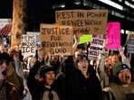 People hold signs and chant during a protest the day after the fatal shooting of Minneapolis resident Renee Nicole Good by a U.S. Immigration and Customs Enforcement (ICE) agent, outside the ICE Field Office in Phoenix, Arizona, U.S., January 8, 2026.    REUTERS/Rebecca Noble