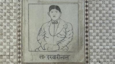 A corner wall shows something unexpected—a marble tile is etched with the likeness of a man in western-style suit and bow tie. The underlying inscription identifies the figure as L. Darvari Lal. (HT) A corner wall shows something unexpected—a marble tile is etched with the likeness of a man in western-style suit and bow tie. The underlying inscription identifies the figure as L. Darvari Lal. (HT)