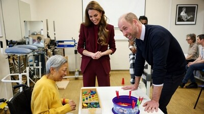 Britain's Prince William (R), Prince of Wales and Catherine (C), Princess of Wales speak to a patient at the therapy gym during a visit to Charing Cross Hospital in west London on January 8, 2026, to highlight the work of NHS staff and volunteers. (Photo by Isabel Infantes / POOL / AFP) (AFP) Britain's Prince William (R), Prince of Wales and Catherine (C), Princess of Wales speak to a patient at the therapy gym during a visit to Charing Cross Hospital in west London on January 8, 2026, to highlight the work of NHS staff and volunteers. (Photo by Isabel Infantes / POOL / AFP) (AFP)