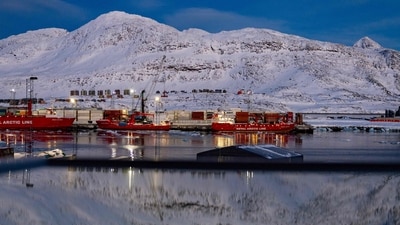 The port and the mountain behind are reflected in a window in Nuuk, Greenland. (AFP/File) The port and the mountain behind are reflected in a window in Nuuk, Greenland. (AFP/File)