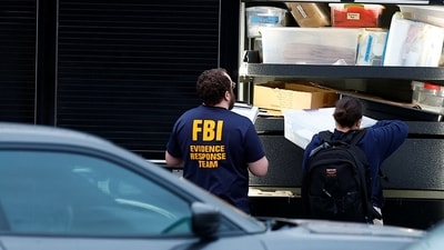 FBI agents work outside Adventist Hospital after U.S. federal agents shot two people in Portland, Oregon. (REUTERS)
