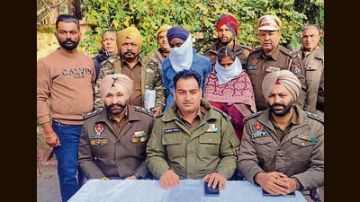 The arrested persons in police custody on Friday. (HT Photo) The arrested persons in police custody on Friday. (HT Photo)