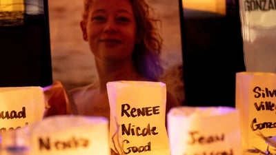 A photo of Renee Good, who was shot and killed by an ICE agent, sits near candles bearing the names of people who have been killed by ICE agents or died in custody, during a vigil for her in Seattle, Washington, U.S. January 8, 2026. (REUTERS)