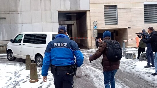 This video grab shows a penitentiary vehicle carrying Jacques Moretti, co-owner of the Swiss bar that went up in flames during New Year's Eve celebrations, leaving the Office of the Public Prosecutor of the Canton of Valais in Sion on January 9, 2026, after he was held in custody and questioned. (AFP)
