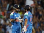 Virat Kohli and Rohit Sharma bump fists during their innings.