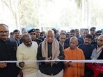 Defence minister Rajnath Singh, Union minister for heavy Industries and steel H.D. Kumaraswamy, and Uttar Pradesh chief minister Yogi Adityanath at the inauguration ceremony of Ashok Leyland’s new manufacturing plant in Lucknow on Friday. (HT Photo)