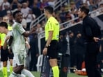 Soccer - Spanish Super Cup - Semi Final - Atletico Madrid v Real Madrid - King Abdullah Sports City, Jeddah, Saudi Arabia - January 8, 2026 Real Madrid's Vinicius Junior reacts after being substituted as Atletico Madrid coach Diego Simeone looks on REUTERS/Vincent West