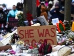 People stop to observe the site where Renee Nicole Good was killed as they march to memorialize her and against the influx of federal agents in the city on January 10, 2026 in Minneapolis, Minnesota.&nbsp;(Getty Images via AFP)