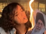 Iranian women can be seen lighting cigarettes by burning the supreme leader’s photos.