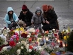 People visit a memorial set up where Renee Good was shot and killed by federal agents on January 08, 2026 in Minneapolis, Minnesota. 