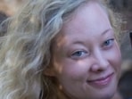 Renee Good can be heard speaking to the ICE agent before backing her car up. 