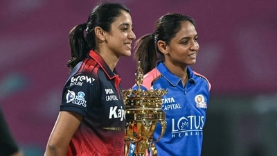 Smriti Mandhana leads RCB, who are 2024 champions, while Harmanpreet Kaur leads 2023 and 2025 champion Mumbai Indians in this tournament. It was RCB who won the toss at DY Patil Stadium, and opted to chase. (AFP) Smriti Mandhana leads RCB, who are 2024 champions, while Harmanpreet Kaur leads 2023 and 2025 champion Mumbai Indians in this tournament. It was RCB who won the toss at DY Patil Stadium, and opted to chase. (AFP)