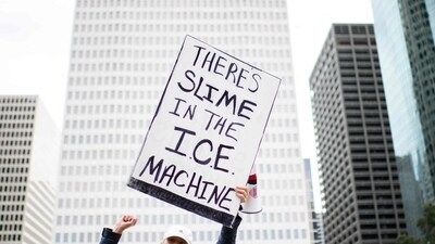 A demonstrator holds a sign during a protest in Houston, Texas on Saturday, January 10, 2026. (AFP) A demonstrator holds a sign during a protest in Houston, Texas on Saturday, January 10, 2026. (AFP)