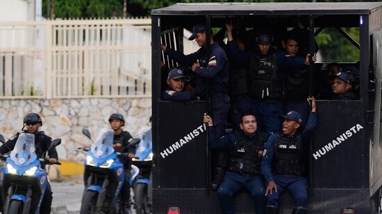 Police patrol near El Helicoide, headquarters of Venezuela's intelligence service and a detention center, in Caracas, Venezuela, Saturday, Jan. 10, 2026. (AP)
