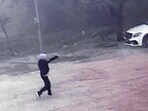 A video grab shows a miscreant firing at the shop near Baddowal in Ludhiana on Saturday. (Gurpreet Singh/HT)