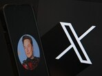 This illustration photograph shows the logo of social network X (formerly Twitter) and a photograph of CEO of social network X, Elon Musk displayed on a smartphone in Brussels.