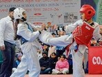 Taekwondo players during a bout in Ludhiana on Saturday. (Manish/HT)