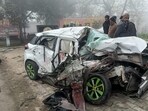 The mangled remains of the car after it collided with a Punjab Roadways bus near Dosarka on Dasuya road in Hoshiarpur district on Saturday, apparently due to dense fog. (HT Photo)