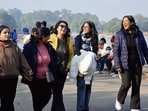 Visitors enjoy a sunny afternoon at the Sukhna Lake, Chandigarh, on Saturday. Met officials said while nights will remain chilly, residents can expect warm afternoons. (SANT ARORA/HT)