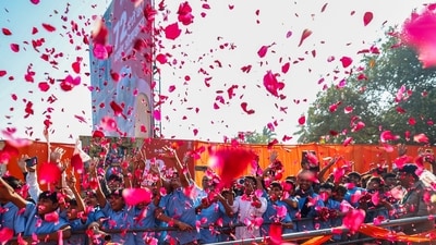 Flower petals were showered on PM Modi as the the crowd lined the streets on both sides and cheered on. (DPR PMO) Flower petals were showered on PM Modi as the the crowd lined the streets on both sides and cheered on. (DPR PMO)