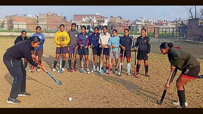 Players practising hockey at the sports nursery set up by the district sports department at Mundiyan Khurd in Ludhiana on Sunday. (HT Photo) Players practising hockey at the sports nursery set up by the district sports department at Mundiyan Khurd in Ludhiana on Sunday. (HT Photo)